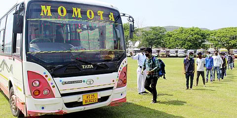 People board a bus after state authorities eased restrictions on inter-district travel for three days, during the nationwide COVID-19 lockdown in Assam's Kamrup. (Photo| ANI)