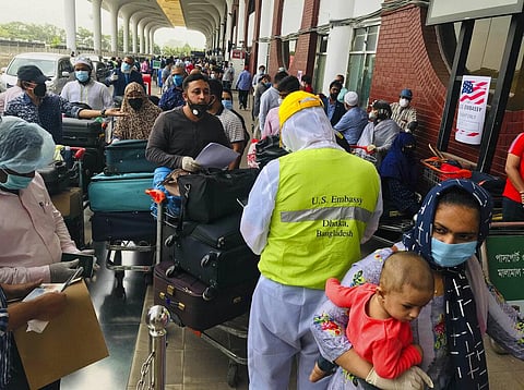 British and American nationals who were stranded in Bangladesh arrive to board repatriation flights at the Hazrat Shahjalal International Airport as the country continues to be in lock down to prevent the spread of the new coronavirus in Dhaka, Bangladesh