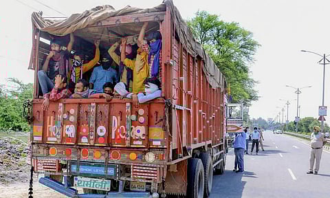 Police intercept a truck carrying labourers mostly drivers of harvesting machines amid ongoing COVID-19 lockdown in Bathinda. (Photo | PTI)
