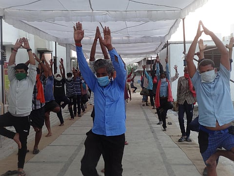 Migrant workers practise yoga at a shelter camp in Chhattisgarh. (Photo | Express)