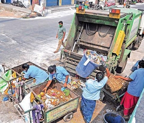 Sanitation workers collect garbage without PPE in Krishna Lanka, Vijayawada | Prasant Madugula