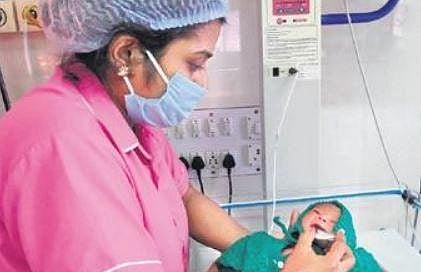 A newborn being fed milk from the human milk bank at Coimbatore Medical College Hospital | Express