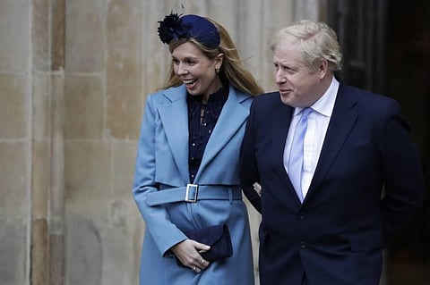 In this file photo, Britain's Prime Minister Boris Johnson and his partner Carrie Symonds arrive to attend the annual Commonwealth Day service at Westminster Abbey in London. (Photo | AP)