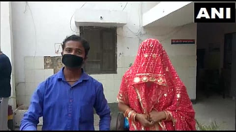 Guddu with his wife Savita. (Photo | Twitter/ANI)