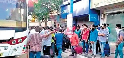 Odia workers boarding a bus at Surat on Monday  I Express