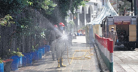 A Delhi Fire Service official sanitisatises Nizamuddin area, one of the COVID-19 hotspots in New Delhi. (Photo | Anil Shakya, EPS)