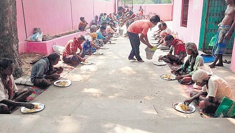 Cooked food being served on premises of a gram panchayat office in Mahanga. (Photo| EPS)