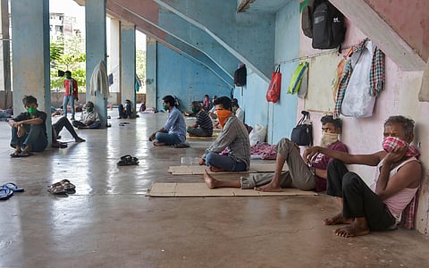 Migrant workers at a temporary camp set up on the premises of a stadium, during ongoing COVID-19 lockdown.(Photo | PTI)