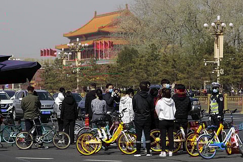 With air raid sirens wailing and flags at half-mast, China on Saturday held a three-minute nationwide moment of reflection to honor those who have died in the coronavirus outbreak, especially 'martyrs' who fell while fighting what has become a global pand