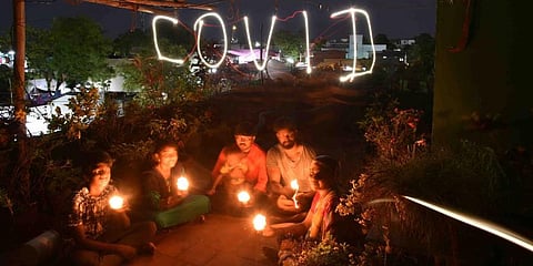 Following the clarion call by PM Narendra Modi to light lamps to cheer up the nation while under coronavirus lockdown, a family lights the lamp at Tuticorin. (Photo | V Karthikalagu, EPS)