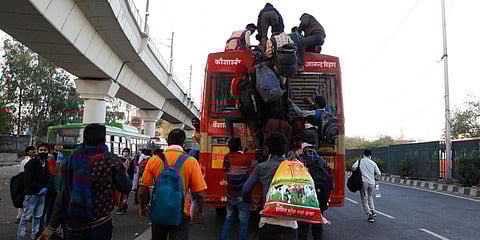 Migrants on their way to home at Anand Vihar during the countrywide lockdown in Delhi on Sunday. (Photo| Anil Shakya, EPS)