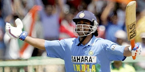 MS Dhoni celebrates after scoring his maiden ODI century during the second ODI between India and Pakistan in Visakhapatnam, 05 April 2005. (File Photo | AFP)