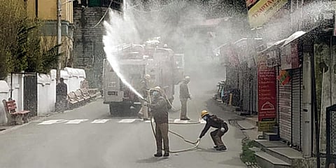 Municipal workers spraying disinfectant to contain the spread of coronavirus, in Shimla. (File photo| ANI)