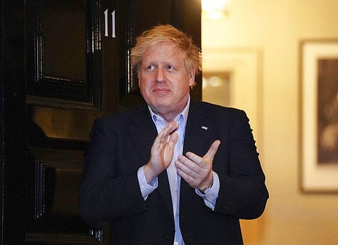 Britain's Prime Minister Boris Johnson claps outside 11 Downing Street to salute local heroes during Thursday's nationwide Clap for Carers NHS initiative to applaud workers fighting the coronavirus pandemic, in London. (Photo | AP)