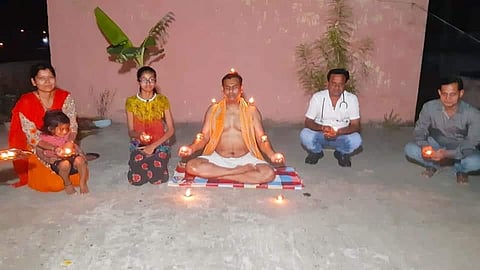45- year-old yoga expert Mahendra Priyadarshi meditating with his family. (Photo | EPS)