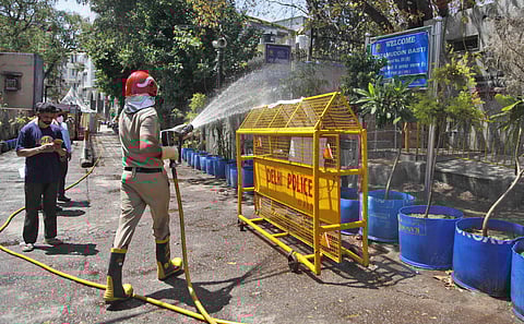 Delhi fire service staff sanitise area near the Nizamuddin mosque in New Delhi.(Photo | Anil Shakya, EPS)