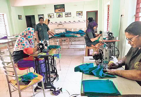 Members of women self-help groups under the Kottoor Eco-tourism Development Committee making face masks | Express
