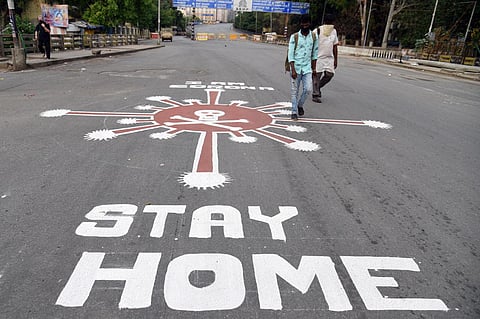 Coronavirus awareness message painted on road near Anand Rao flyover in Bengaluru. (Photo | Nagaraja Gadekal,EPS)