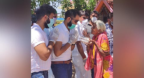 Desi Masala staffers distribute food