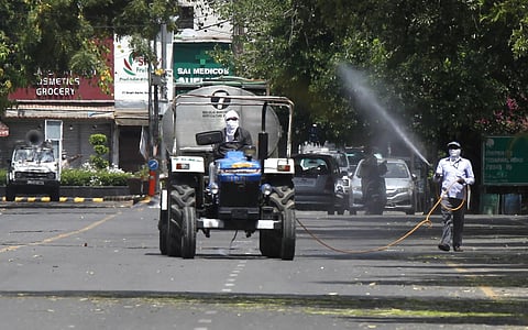 Municipality workers sanitize the bengali market area in New Delhi. (Photo | Anil Shakya, EPS)