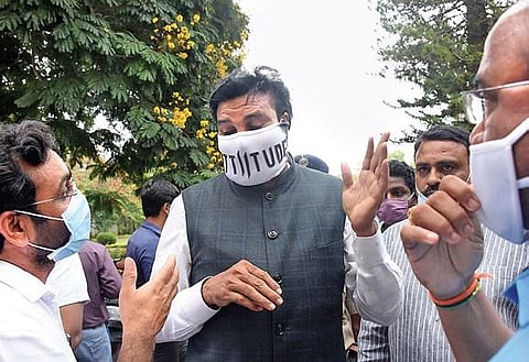 Minister B Sriramulu interacting with officials on the measures taken to fight Covid-19 in the district at the Zilla Panchayat auditorium in Mysuru on Wednesday  | Udayshankar S