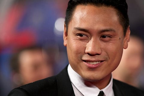 US film director and screenwriter Jon M Chu poses for pictures on the red carpet. (Photo | AFP)