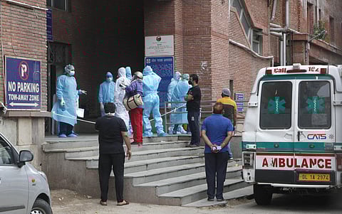Medical Staff wearing PPE kit stand at LNJP hospital in delhi during the nationwide lockdown on Sunday. (Photo | Anil Shakya/EPS)