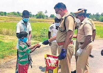 S Jeyakumar, Villupuram SP, with 10-year-old Jeeva | Express