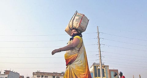 Migrant workers walk along the national highway in Ghaziabad. (Photo| Anil Shakya, EPS)