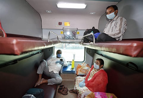Passengers sit inside a coach of the New Delhi-Bilaspur special train before it was flagged off from the New Delhi Railway Station amid COVID-19 lockdown in New Delhi Tuesday May 12 2020. (Photo | PTI)