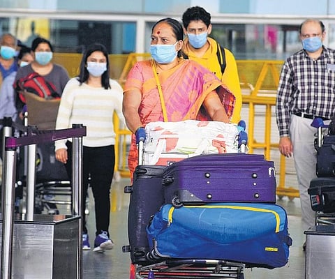 The first batch of people repatriated to India from London arrive at Kempegowda International Airport early on Monday.