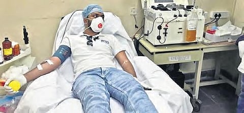 Akhil is the first cured patient to donate blood at Gandhi Hospital on Monday