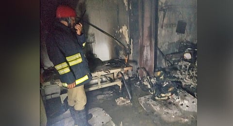 A firefighter inspects the Krishna Children’s Hospital at Nampally