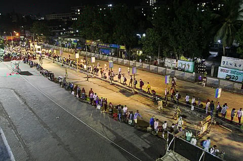 Migrants waiting in queues to board Shramik express train to Uttar Pradesh at Borivali station during the ongoing nationwide COVID-19 lockdown in Mumbai Tuesday May 12 2020. (Photo | PTI)