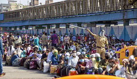 Migrants arrive at Bandra Terminus to board a special train to Jaunpur UP arranged by Maharashtra government during the ongoing nationwide COVID-19 lockdown in Mumbai Wednesday May 13 2020. (Photo | PTI)