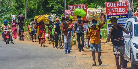 Migrant workers on the long march towards their native places.(Photo | Biswanath Swain, EPS)