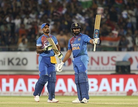 India's captain Rohit Sharma, right celebrates his fifty as Shikhar Dhawan looks on. (Photo | AP)