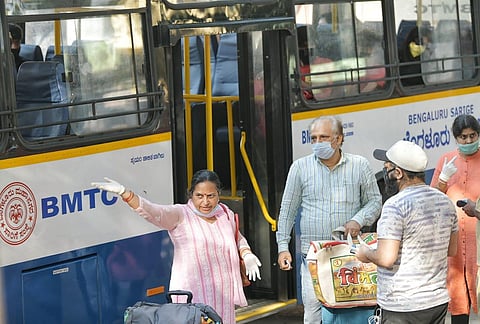 Biswas Mishra (in pink) expressing her dissent to co-passengers (Photo | Meghana Sastry)