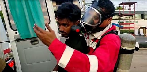 A rescue worker carries an unconscious youth after a major chemical gas leakage at LG Polymers industry near Visakhapatnam. (Photo| EPS)