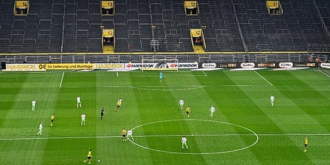 EMPTY STADIUMS: Only around 300 people will be allowed into the stadium on matchday. They are divided into three zones to avoid any contact between each group. Only players, match officials, first aid personnel and a small group of photographers are allowed on the pitch. (Photo | AP)