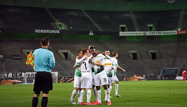 DURING GAMES: Players and the match officials do not need to wear masks, but everyone else on the pitchside does, including substitutes on the bench.  Players have been told that physical contact should only be made as a result of play during the match and embracing or high-fives to celebrate goals is to be strictly avoided. (Photo | Bundesliga Twitter)