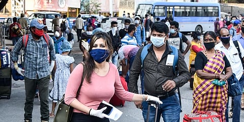 Passengers queue up for the train from Delhi to Bengaluru, outside the Secunderabad Railway Station. (Photo | Vinay Madapu, EPS)