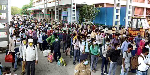Stranded migrant laborers queue to board a special train to Rewa (Madhya Pradesh) from MGR Central railway station after the government eased a nationwide lockdown imposed as a preventive measure against the COVID-19 coronavirus, in Chennai. (Photo| ANI)