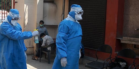 Health workers wear protective gear sanitize their body during the nation wide lockdown in New Delhi. (Photo | Shekhar Yadav, EPS)
