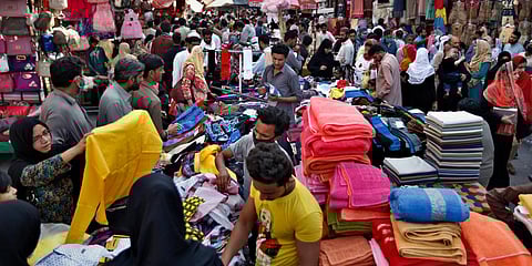 People shop at a busy market after the government relaxed the weeks-long lockdown that was enforced to help curb the spread of the coronavirus, in Rawalpindi.(Photo| AP)