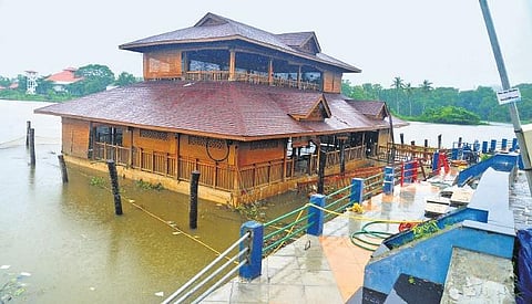 After five days of effort, workers were able to lift the submerged Flotilla restaurant at Veli Tourist Village ,Vincent Pulickal
