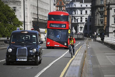 A cyclist rides his bike along Waterloo Bridge, in London. (Photo | AP)