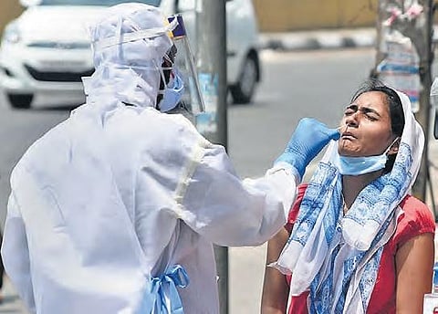 A Health worker testing for COVID-19. (Photo | EPS)