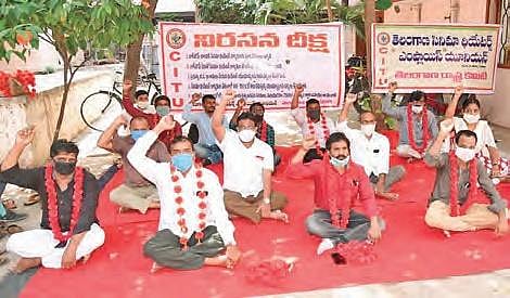 Telangana cinema theatre employees along with  CITU members stage a protest.