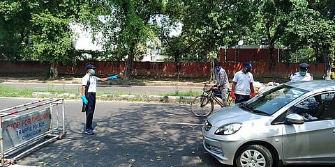 Security personnel check the IDs of commuters during lockdown due to coronavirus pandemic, in Chandigarh. (File photo| ANI)